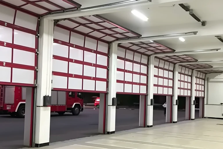 A row of heavy-duty commercial fire station doors installed in an emergency response facility. ABX OEM manufacturer engineers high-speed automatic solutions with power redundancy and CE/ISO compliance for government and wholesale projects.