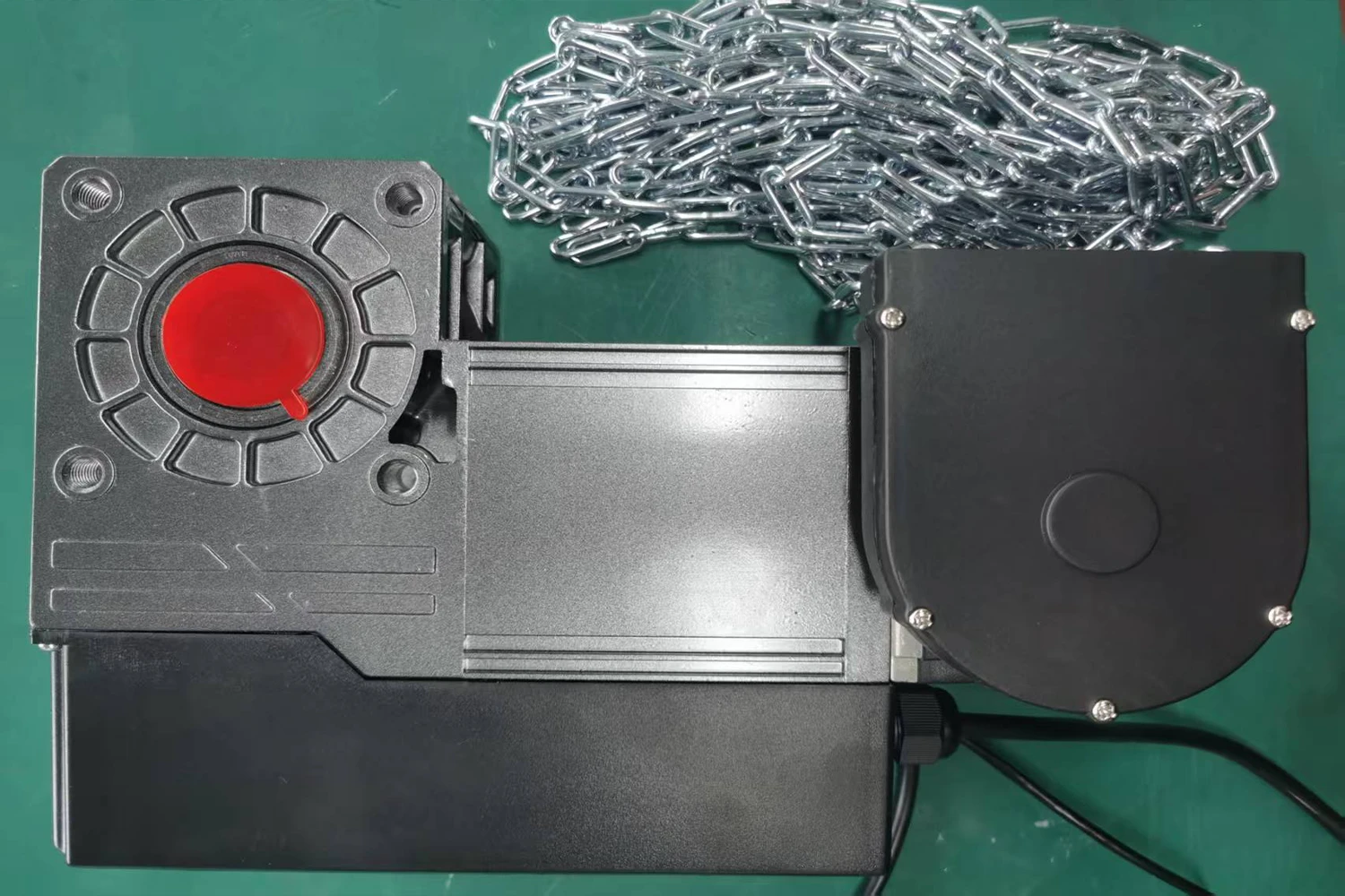 Close-up of an ABX heavy-duty commercial garage door operator motor equipped with a manual release chain, engineered for smart automation and zero reprogramming in industrial facilities.