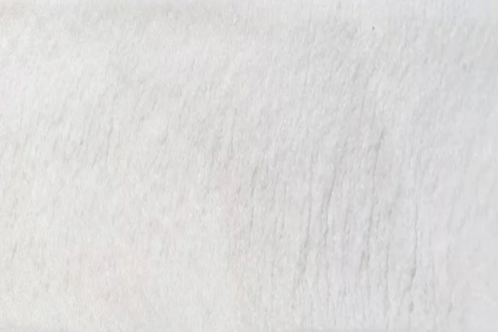 Close-up cross-section of the high-density PU foam core, showcasing the fine, closed-cell structure that guarantees superior thermal efficiency for ABX heavy-duty steel back garage doors.