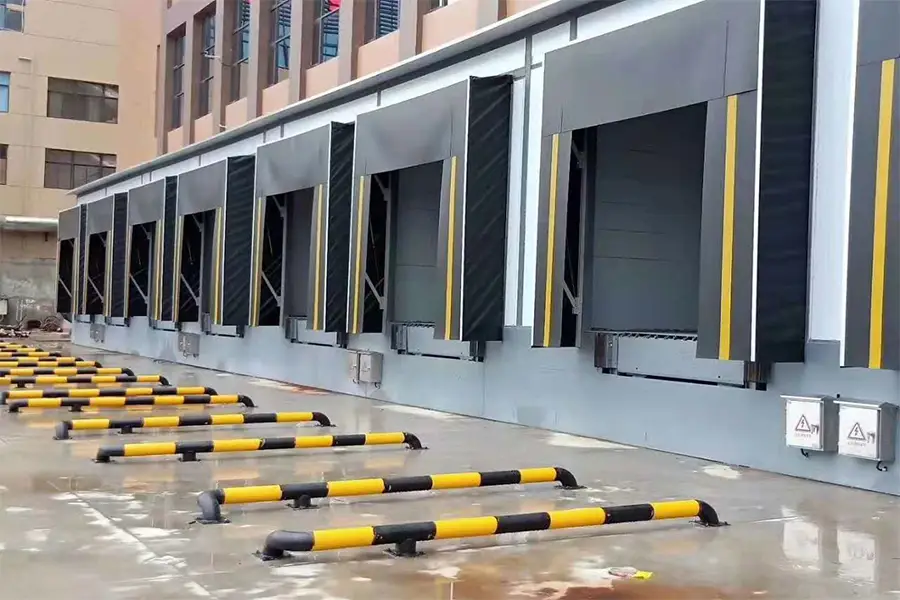 Multiple loading dock shelters and levelers at a logistics distribution center.